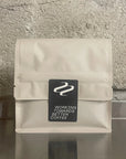Dos du sachet de café Tribute avec le logo Working Towards Better Coffee